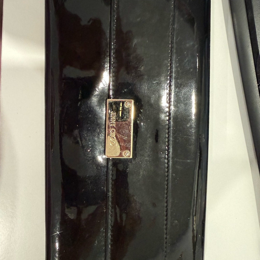 Jimmy Choo Black Patent Clutch with Gold Nameplate